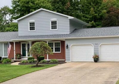 Shown: West Millcreek, PA, split- level ranch home with new roof installed by Daugherty Roofing 814 of Erie, PA