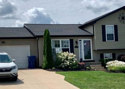 Ranch home in Millcreek, PA3 with new roof, overhang and gutters installed by Daugherty Roofing 814.
