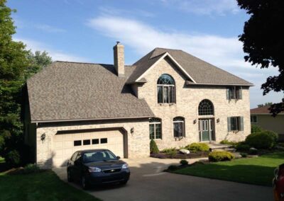 Shown: Two-story contemporary home with new roof in Harbor Creek, PA. Installed by Daugherty Roofing 814.